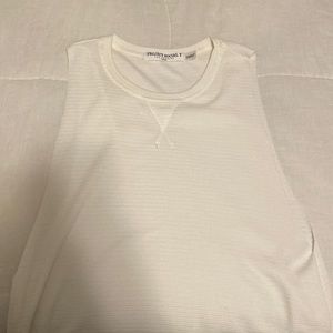 off white colored tank, large arm holes, super cute with a bandeau bra under!